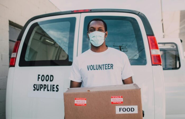 food bank volunteer working with food bank software